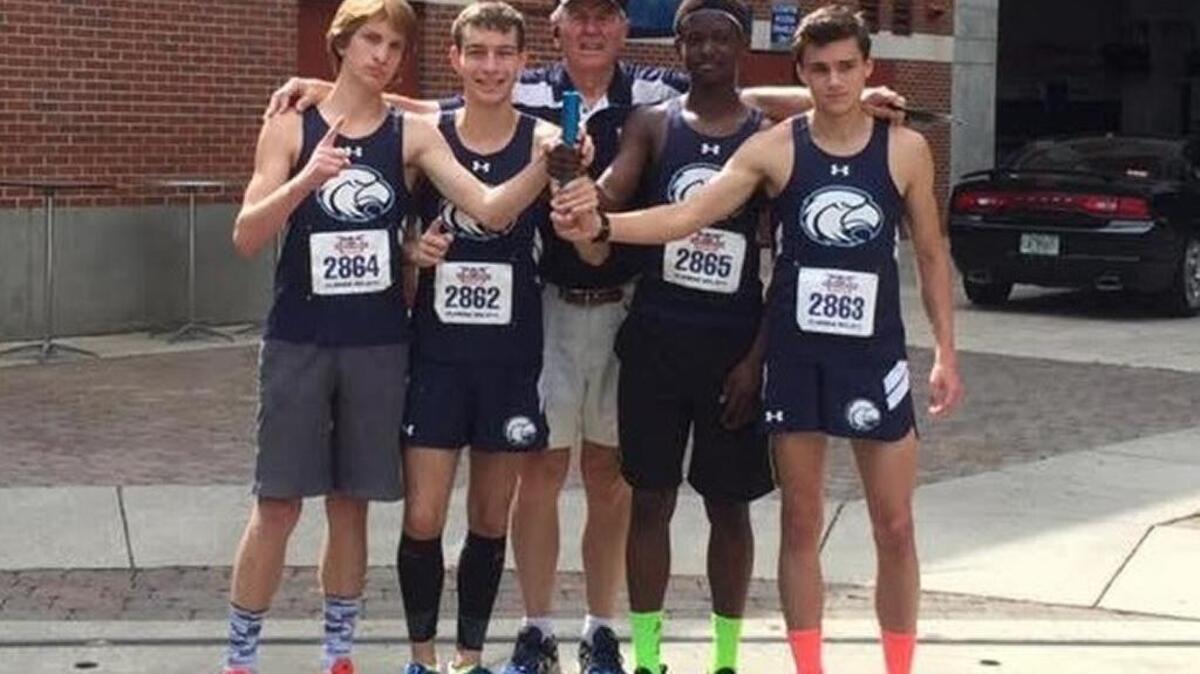 Hilton Head’s distance medley relay team gets together for a photo with coach Max Mayo after setting a new state mark in winning the Florida Relays. From left: Sam Gilman, Danny Shaughnessy, Mayo, Jacquel Williams and Ben Gilman.
