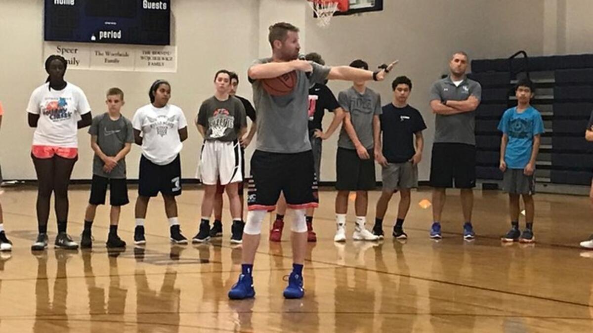 Tyler Coston speaks on Tuesday during the Point Guard College camp at Hilton Head Preparatory School.