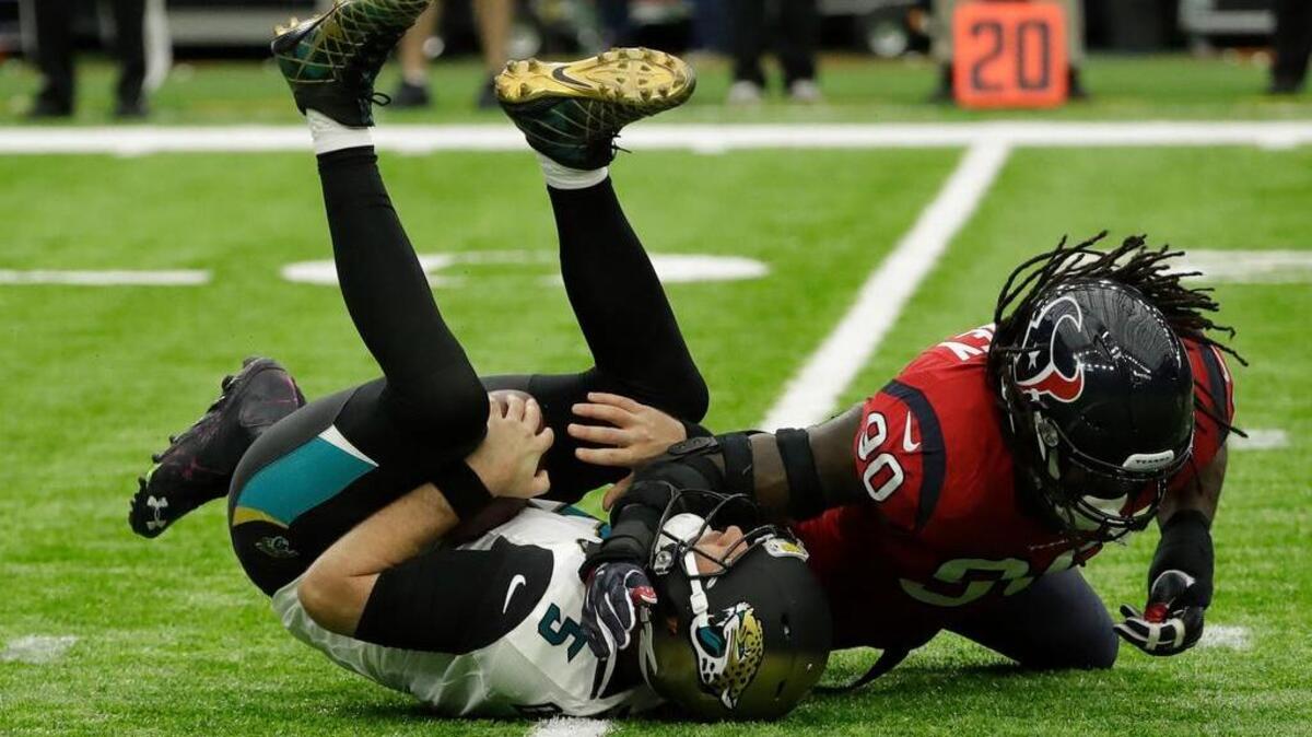 Houston’s Jadeveon Clowney (90) sacks Jacksonville quarterback Blake Bortles.