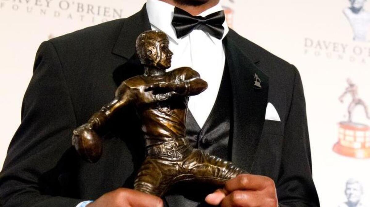Deshaun Watson shows the National Quarterback Award trophy he received at the annual Davey O'Brien award ceremony in Fort Worth, Texas, Monday, Feb. 20, 2017. Watson was presented his second consecutive Davey O'Brien Award as the nation's top quarterback.