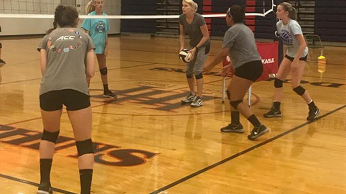 Jola Graham teaches players the finer points of volleyball during the Instructional Volleyball Camp at Hilton Head Prep.