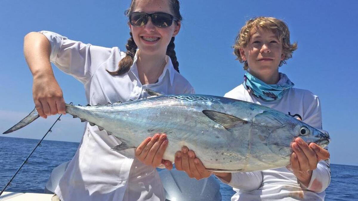 Carlyle Cornell, 13, and Jimmy Sewell, 15, show off a big bonito.
