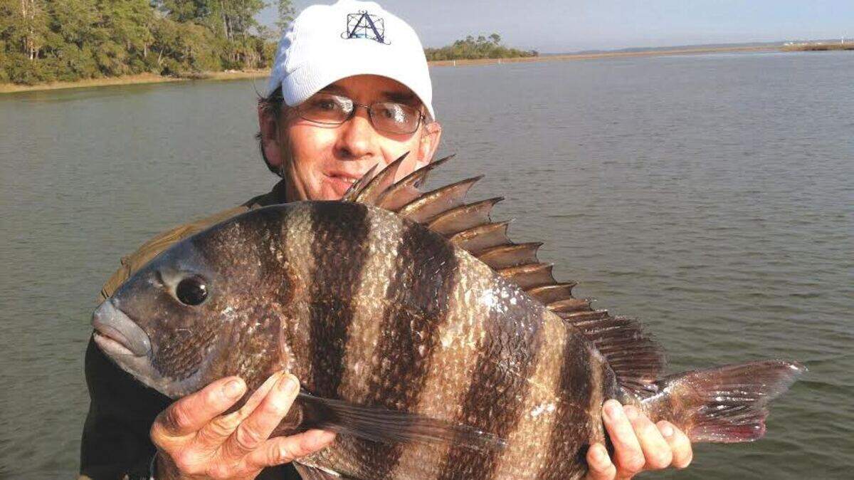 Collins Doughtie shows off a 10-pound sheepshead he caught.