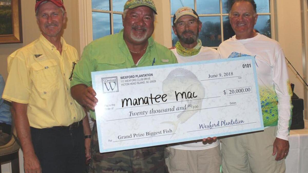 Manatee Mac's Harry Morales wins top prize. Bass Pro President Jim Hagale far right.