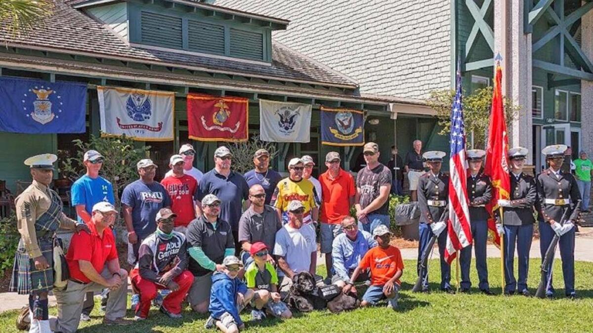 Wounded servicemen pose for a photo at the Fishing for Military Heroes tournament at Hampton Lake.