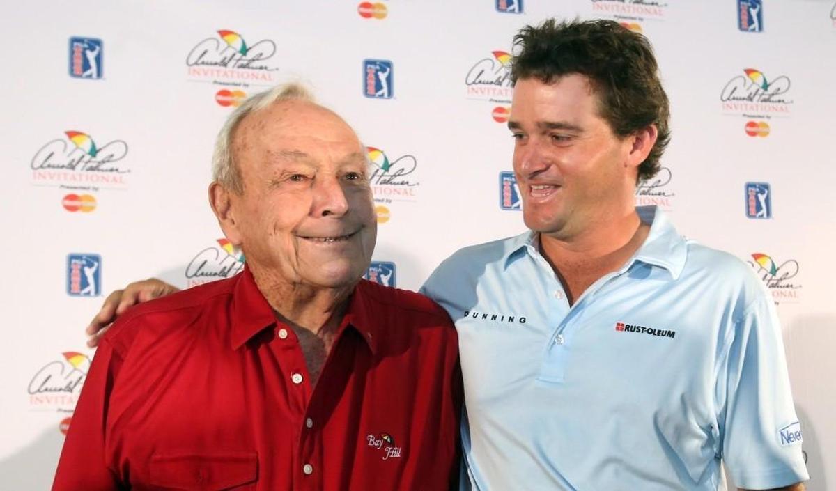 Golf legend Arnold Palmer, left, and his grandson Sam Saunders, who is a professional golfer, appear at a news conference March 18, 2015, at the Arnold Palmer Invitational in Orlando, Fla.