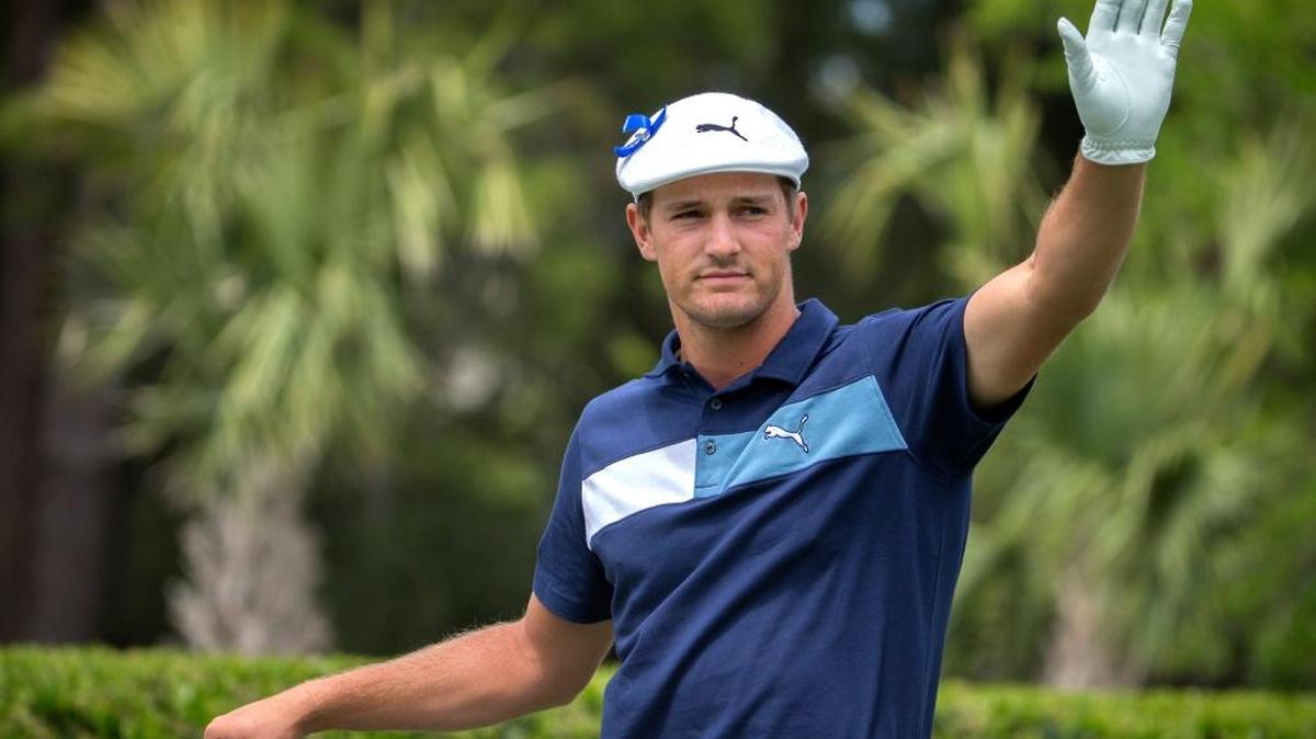 Bryson DeChambeau waves to the crowd after being introduced on the first tee during the first round of the RBC Heritage on Thursday on Hilton Head Island.