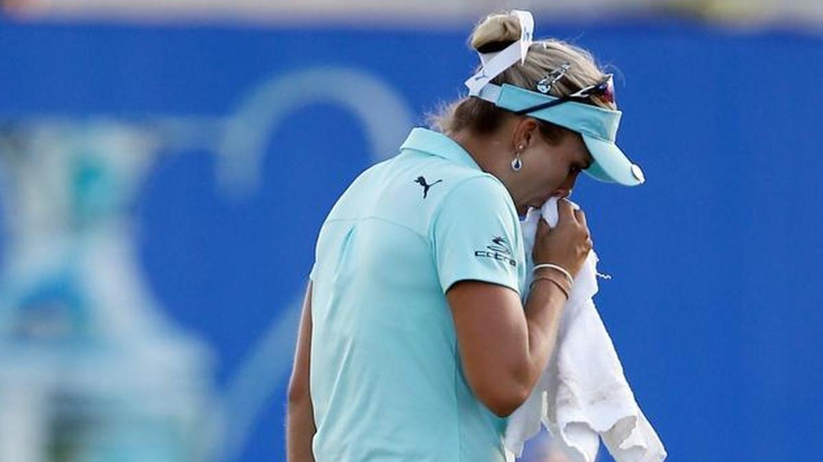 Lexi Thompson composes herself on 18th green during the final round of the ANA Inspiration in Rancho Mirage, Calif. Midway through the round, Thompson had been assessed a four-stroke penalty for a rules violation one day earlier.