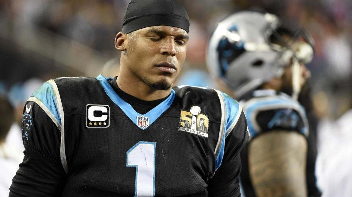 Carolina Panthers quarterback Cam Newton (1) looks pained Sunday as he walks the sideline while the Denver Broncos run the clock down in the fourth quarter in Super Bowl 50 at Levi's Stadium in Santa Clara, Calif. The Broncos won, 24-10.