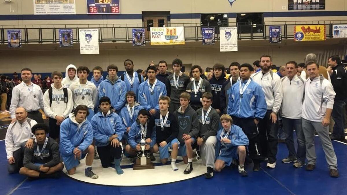 The Hilton Head Island wrestling team and coaches pose with the state runner-up trophy after losing 36-35 to Eastside on Saturday in the Class 3-A State Championship at Dreher High School in Columbia.