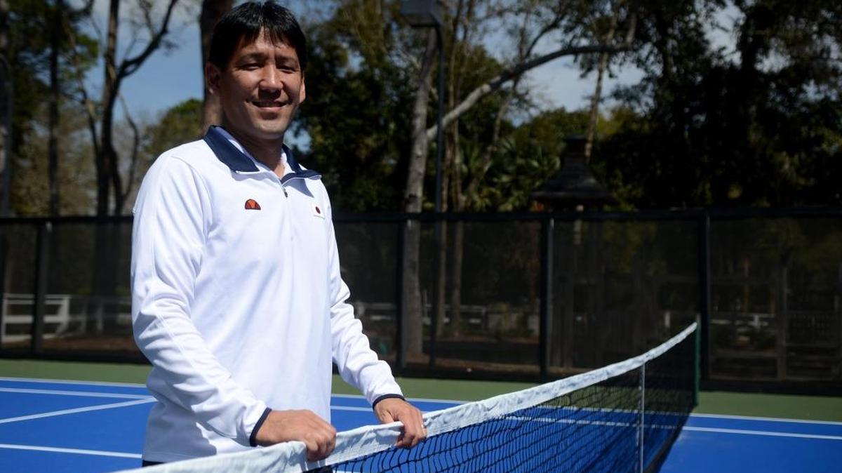Tom Shimada of Hilton Head Island stands for a portrait on one of the tennis courts near his home Friday in Palmetto Hall on Hilton Head Island. Shimada returned to the United States on Monday after coaching Japan in the Davis Cup.